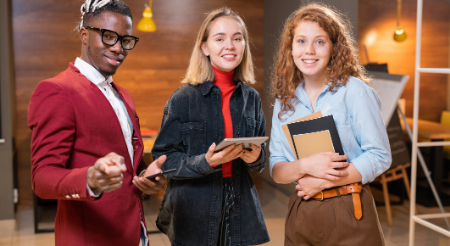 Three students smiling 